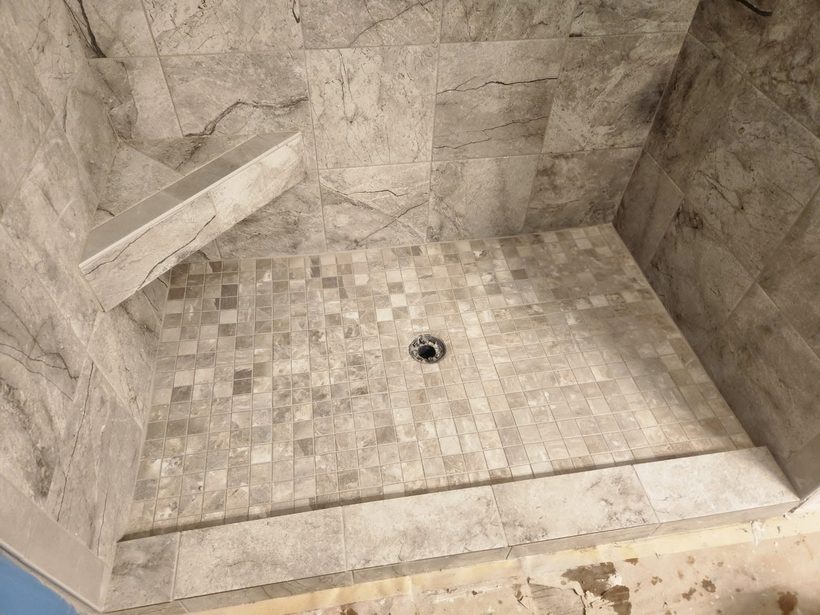 Marble tile shower with bench — B&W Floor Covering, Lake of the Ozarks